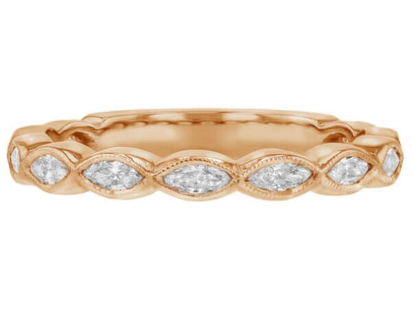 A stunning 18k rose gold wedding band adorned with marquise diamonds.