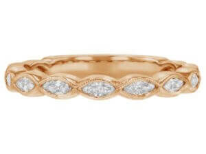 A ladies rose gold ring adorned with marquise diamonds (C1069).