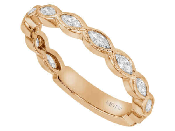 A stunning ladies' wedding band featuring an exquisite 18k rose gold band adorned with marquise-cut diamonds.