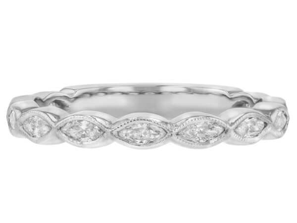 A C1069 white gold band adorned with marquise diamonds.