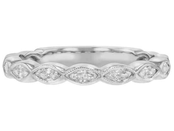 A ladies' white gold band with marquise diamond accents, perfect for a wedding.