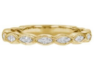 A ladies' yellow gold wedding band with marquise diamonds in the center.