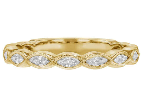 A ladies' yellow gold wedding band with marquise diamonds in the center.