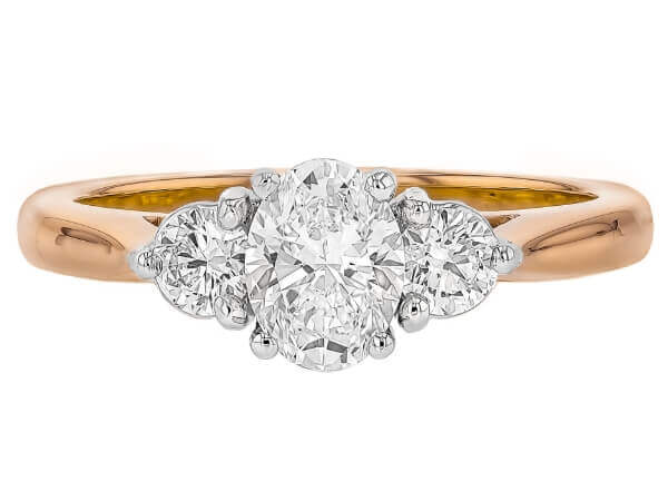 Oval diamond trilogy engagement ring in 18k rose gold. -top view