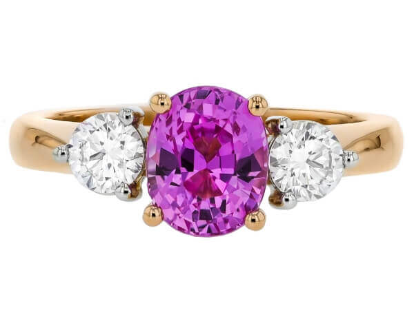 An Oval Pink Sapphire and Diamond Trilogy Engagement Ring C1202.