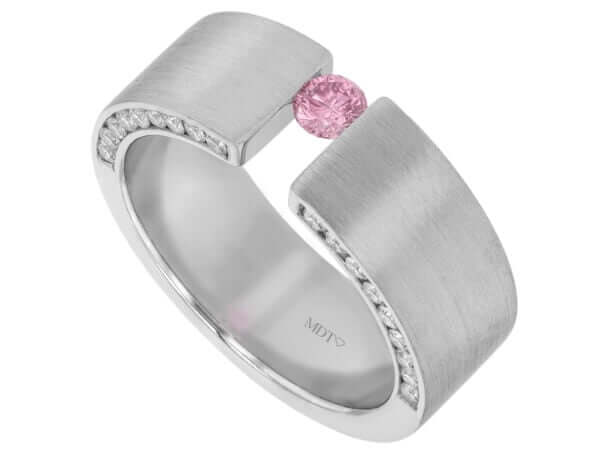 A white gold Tension Set Ring with a Pink Diamond Tension Set Ring with Diamonds on the Face of the Band C827 and diamonds.