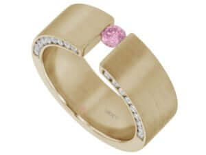 A yellow gold tension set ring featuring a radiant pink sapphire and sparkling diamonds.