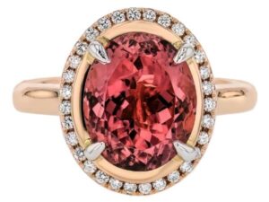 A stunning oval Pink Tourmaline and Diamond Halo Engagement Ring C1249 with a diamond halo.
