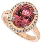 A stunning oval Pink Tourmaline and Diamond Halo Engagement Ring C1249.