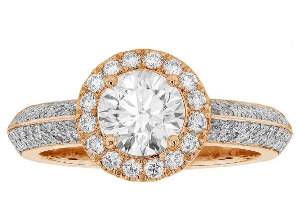 An oval diamond halo engagement ring with a pave diamond band in rose gold.