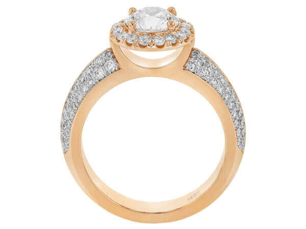 A stunning Halo Engagement Ring set in rose gold, featuring a dazzling Round Diamond surrounded by shimmering diamonds on a Pave Diamond Band.