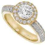 An exquisite engagement ring featuring a stunning round diamond halo elegantly set in yellow gold.