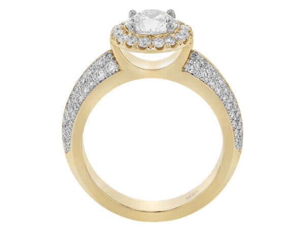 This round diamond halo engagement ring showcases a stunning yellow gold band adorned with pave diamonds.