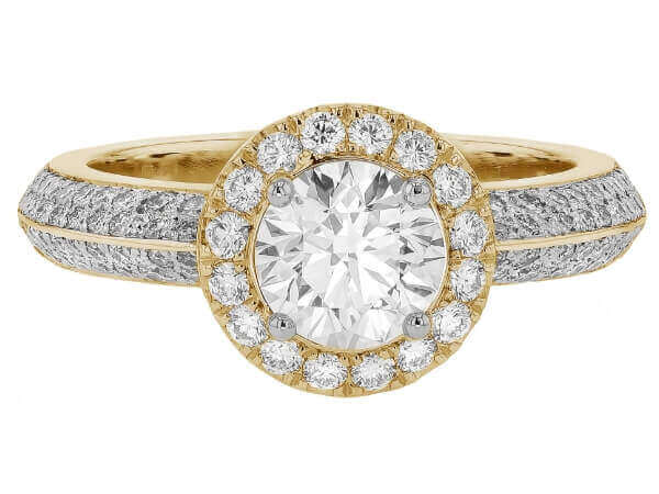 An oval diamond halo engagement ring in yellow gold with a pave diamond band.