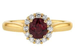 An Oval Ruby Engagement Ring with Diamond Halo C1215 in yellow gold.
