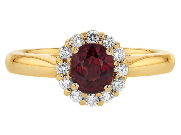 An Oval Ruby Engagement Ring with Diamond Halo C1215 in yellow gold.