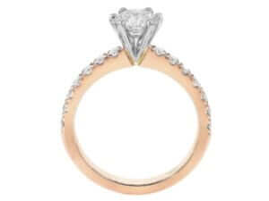 A Six Claw Diamond Engagement Ring with Diamond Band C961, elegantly designed in rose gold. -Side view