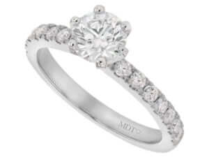 A white gold diamond engagement ring with six claws and claw set diamond band.