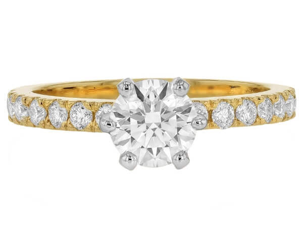 A round diamond engagement ring set in yellow gold with a six claw design. -Top view