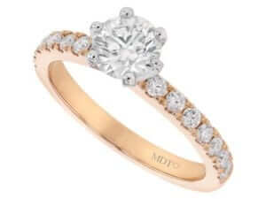 A round Six Claw Diamond Engagement Ring with Diamond Band C961 in rose gold.