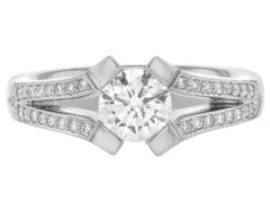 A white gold engagement ring with an oval cut diamond, featuring a split band.