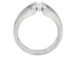 A white gold engagement ring with an oval cut diamond, featuring a split band.