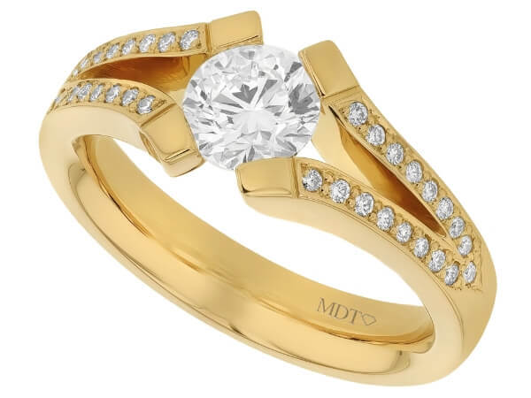 A stunning yellow gold engagement ring featuring an oval cut diamond on a split band.