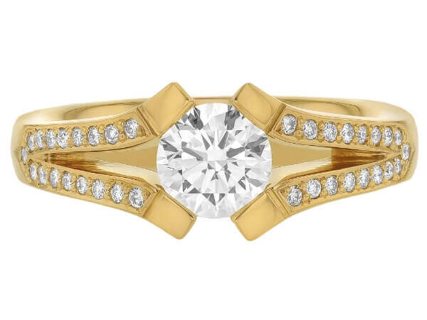 A yellow gold engagement ring with an oval cut diamond set on a split band.