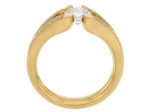 A Diamond Tension Set Ring in Yellow Gold featuring an Oval Cut Diamond.