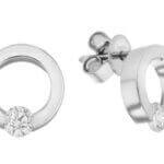 A pair of white Gold Tension Set .15ct Diamond Earrings C1101. tension set diamond in the center.