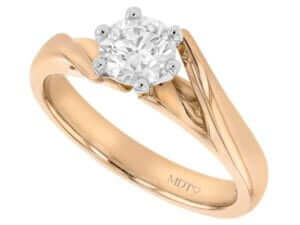 An 18ct rose gold engagement ring with a round cut diamond, the perfect diamond engagement ring option combining elegance and luxury in its twiste band solitaire design.