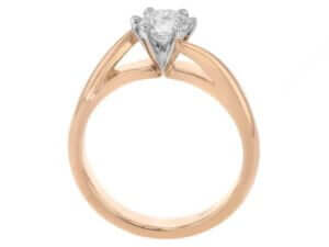 A solitaire diamond engagement ring with a twisted band in rose gold -Side view