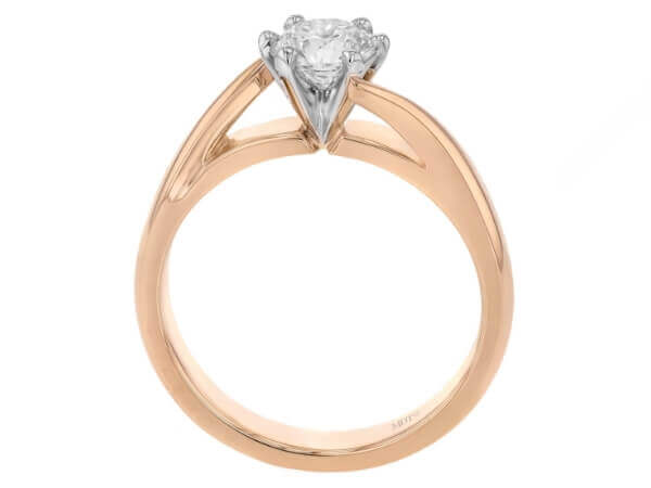 A solitaire diamond engagement ring with a twisted band in rose gold -Side view