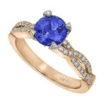 Gold ring with blue sapphire and diamonds.