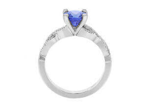 Blue gemstone engagement ring with diamond accents.