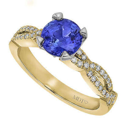 Gold ring with blue sapphire and diamonds.