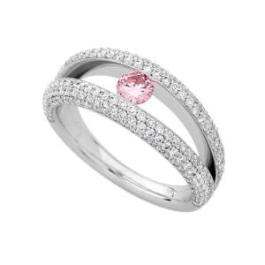 A white gold double band ring with a pink diamond and pavé-set white diamonds on the bands, perfect for those seeking unique engagement rings.