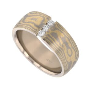 yellow Gold and white gold patterned wedding band, utilising the japanese technique Mokume Gane to fuse the metal, perfect for mens wedding band, featuring three adjoining diamonds set in the middle, available in Melbourne.
