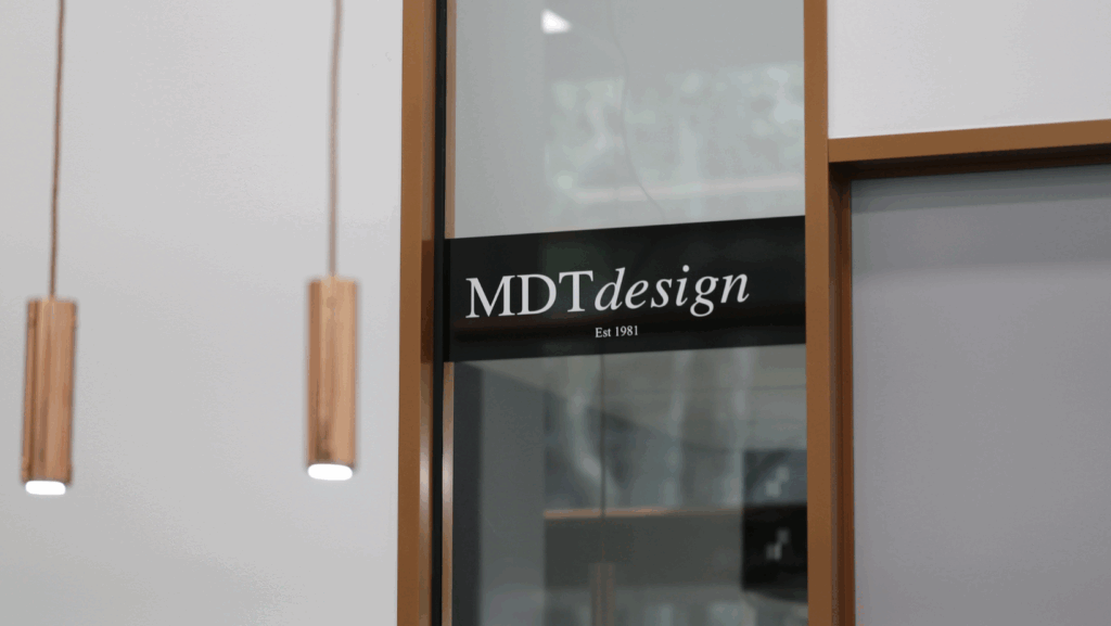 MDT DESIGN boutique window with viewing panel into the on-site Collins Street jewellery workshop, showcasing transparency in handmade design.