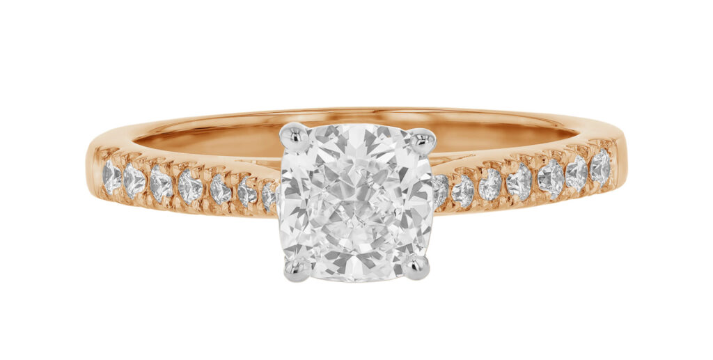 Rose Gold Diamond Engagement Ring Featuring a Cushion Cut Diamond and claw set side diamonds