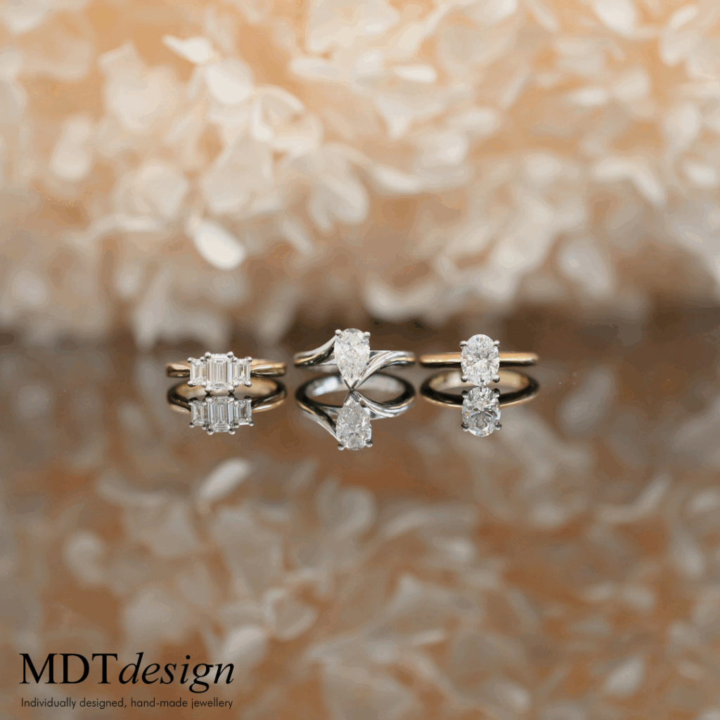 three engagement rings showcasing different varieties, different engagement ring budgets and different engagement ring designs.