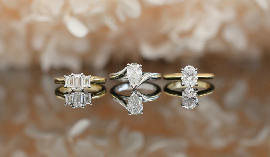 three engagement rings showcasing different varieties, different engagement ring budgets and different engagement ring designs.