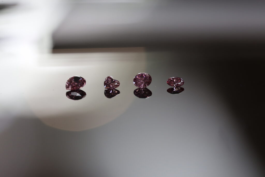 4 varying shaped argyle pink diamonds, loose diamonds waiting to be viewed.