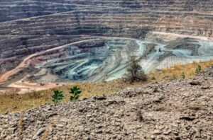 Open-pit diamond mine with terraced excavation levels, showing where natural diamonds are mined and extracted from the earth.