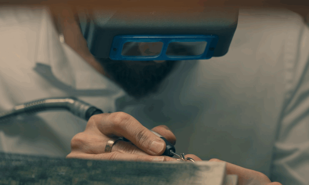 Jeweller making a custom designed engagement ring