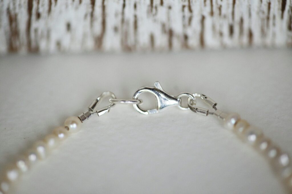 pearl stand with silver clasp