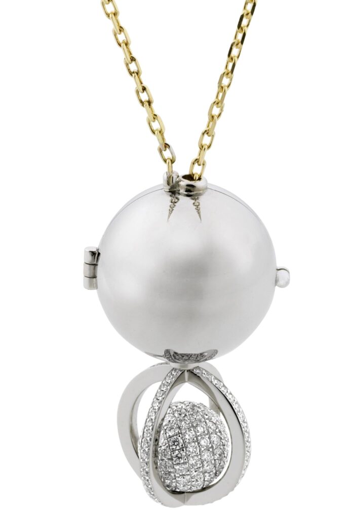 This exquisite 18ct white gold pendant features a locket-type design, showcasing a pave-set round ball encrusted with round brilliant cut diamonds