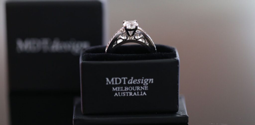 Side view of a cathedral style diamond engagement ring in MDT Design Melbourne box, engagement ring Melbourne proposal.