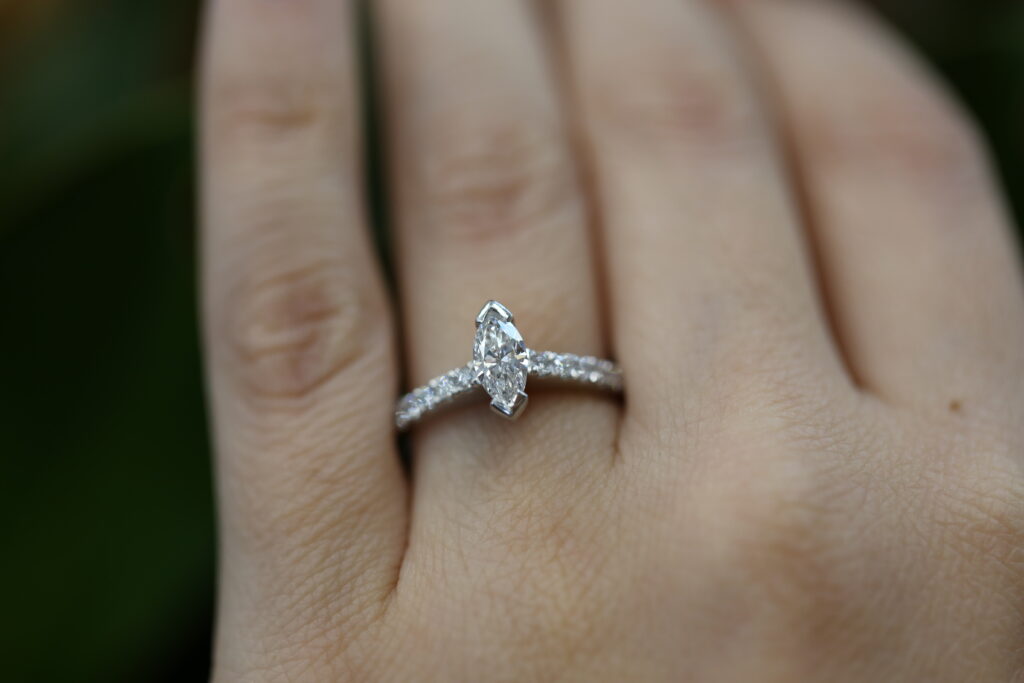 marquise lab grown diamond engagement ring with pavé band in white gold claw setting