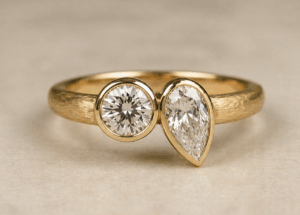 Render of a toi et moi engagement ring in yellow gold